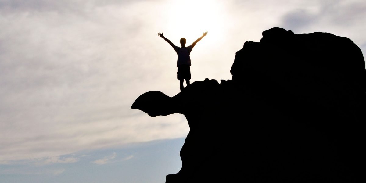 A person celebrating a small, personal achievement or milestone with a sense of joy.