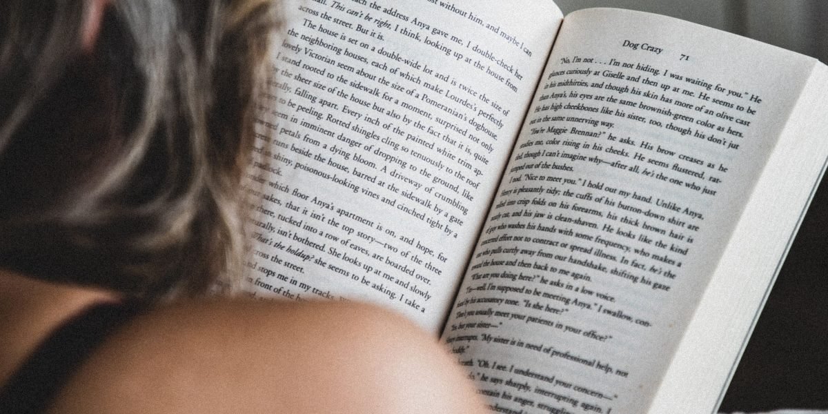 A person finds peace and focus through deep reading, contrasting with the anxiety of digital overload.