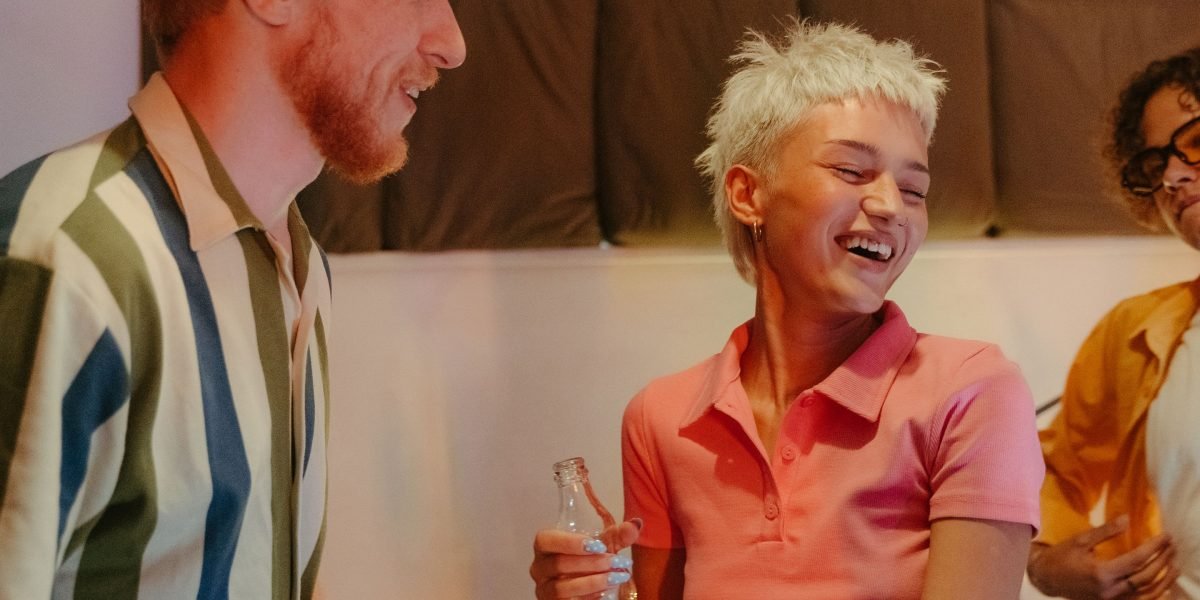 A diverse group of people laughing and interacting, illustrating the importance of real-world connections over virtual escapism.