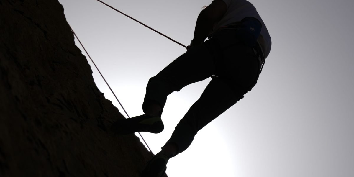 A determined individual confronting an intense, personal challenge, pushing their boundaries.