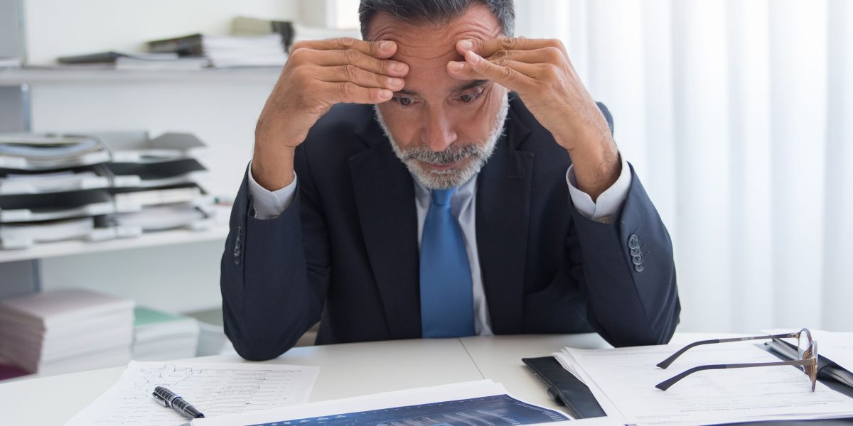 A person contemplating a complex decision with high stakes, reflecting on the potential outcomes.