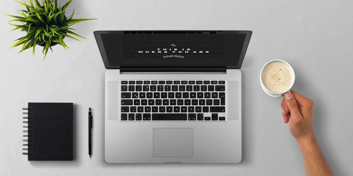 A person deeply focused on their work at a clean, organized desk, demonstrating the mental clarity achieved by mastering an efficient inbox-to-task workflow.