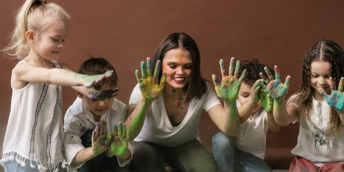 A diverse group of adults and children engaged in an interactive storytelling activity, fostering community and creativity.