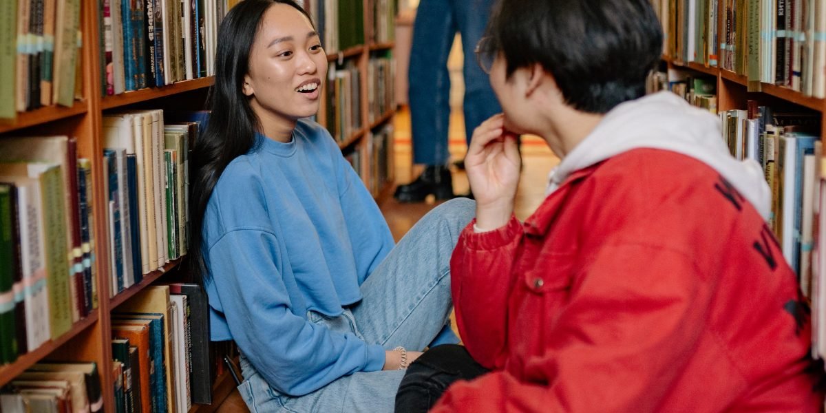 A group of friends engages in discussion, mirroring a book club for audiobooks, fostering community around stories.