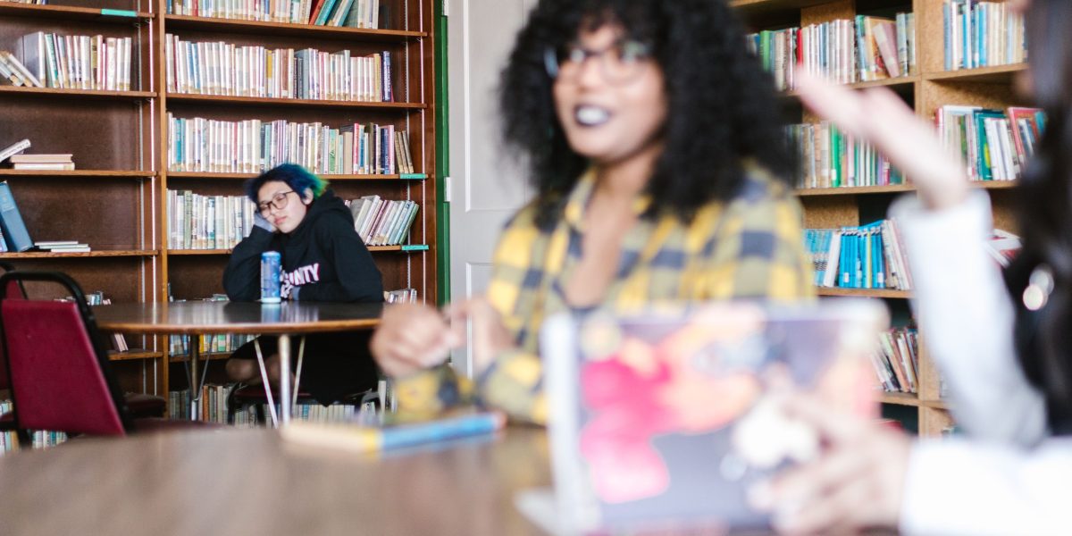 A diverse group of people engaged in a lively book club discussion, sharing insights and thoughts.