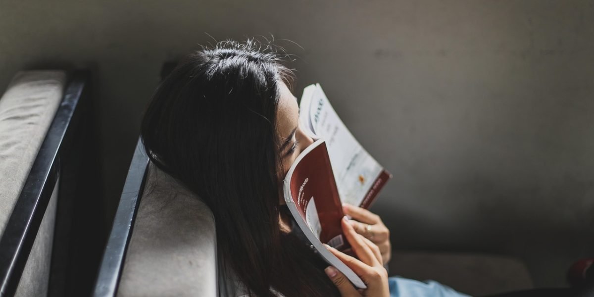 A person thoughtfully reading resources, seeking clarity and understanding on a complex topic.