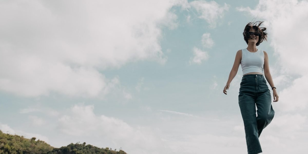 A person reflecting on their journey, indicating steady progress and hope for a balanced life.