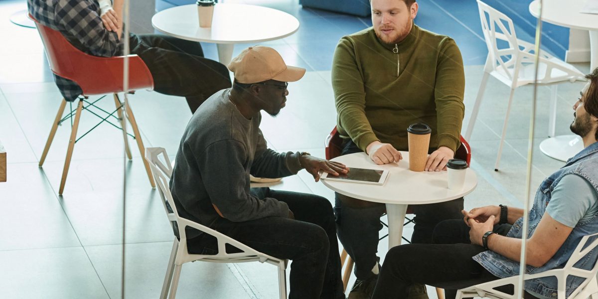 Friends laughing and sharing, embodying the positive connections sought in online communities.