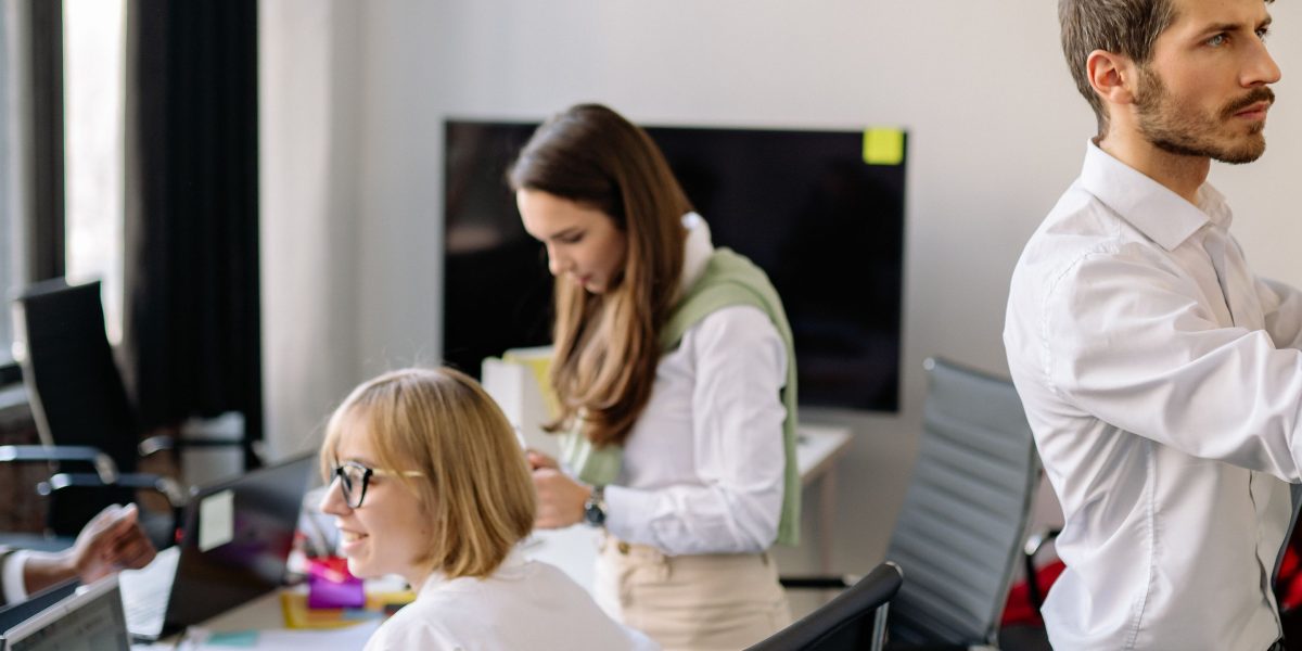 Individuals reviewing options, signifying smart strategies like coupons and discounts for affordable books.