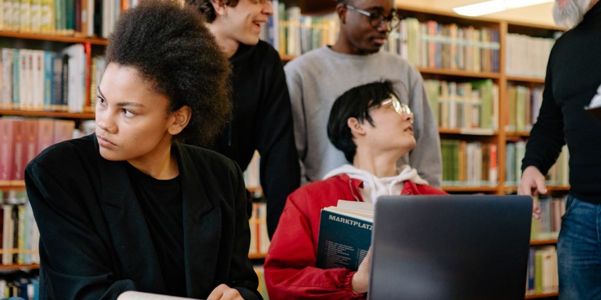 A diverse group of readers actively discussing a book, fostering a sense of community.
