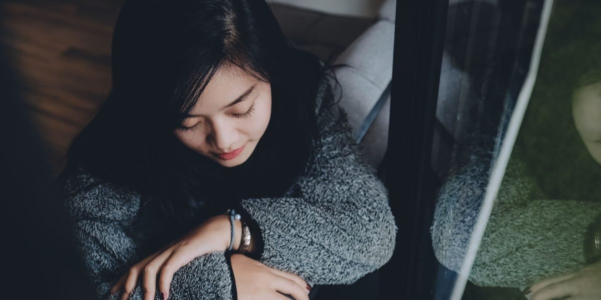 A person deeply engaged in thought, seeking meaningful ways to improve their life.