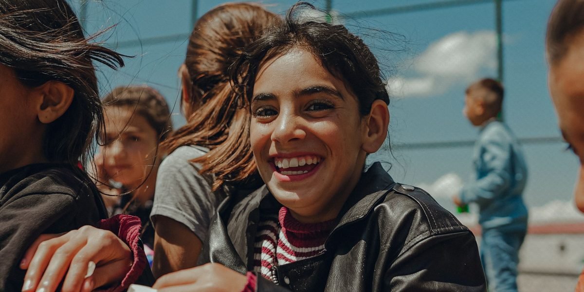 Friends sharing a joyful moment while playing a casual game, fostering connection and positive social interaction.