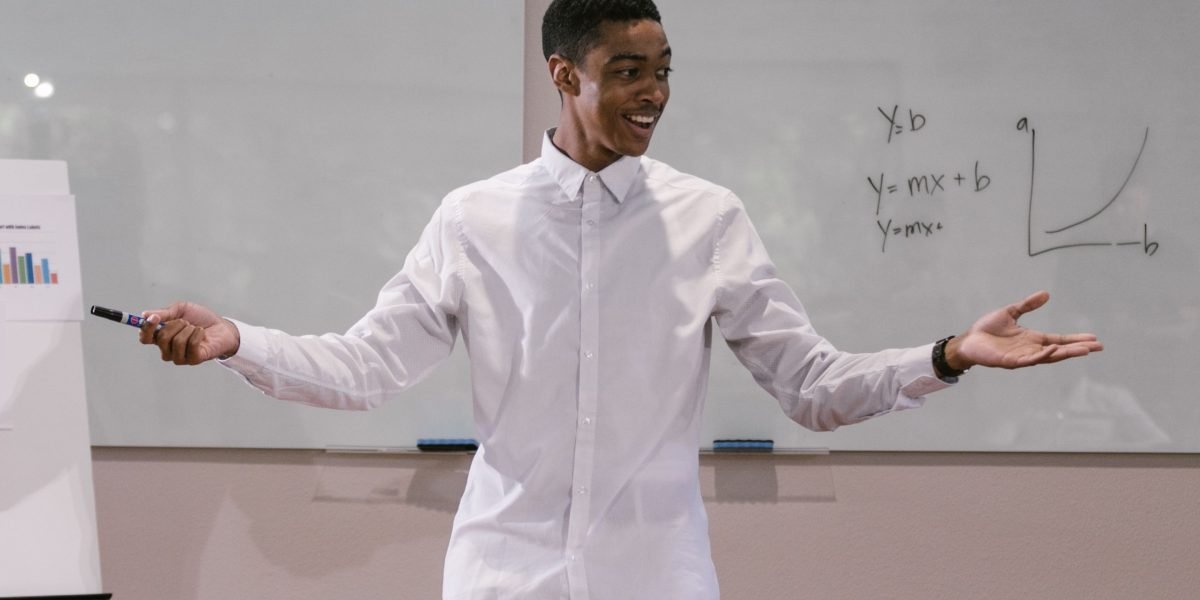 A person confidently presenting to an engaged audience, capturing the essence of leading interactive sessions.